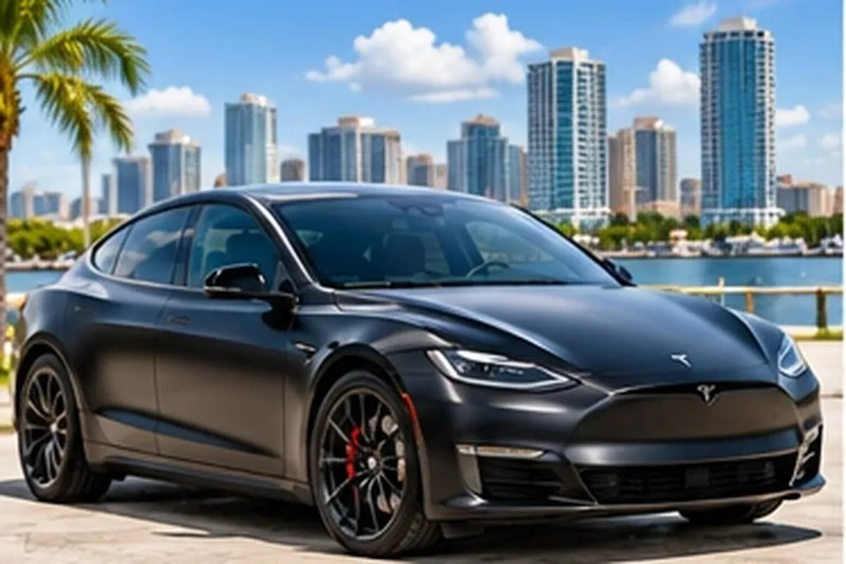 Matte gray wrapped Tesla sedan by the Tampa waterfront